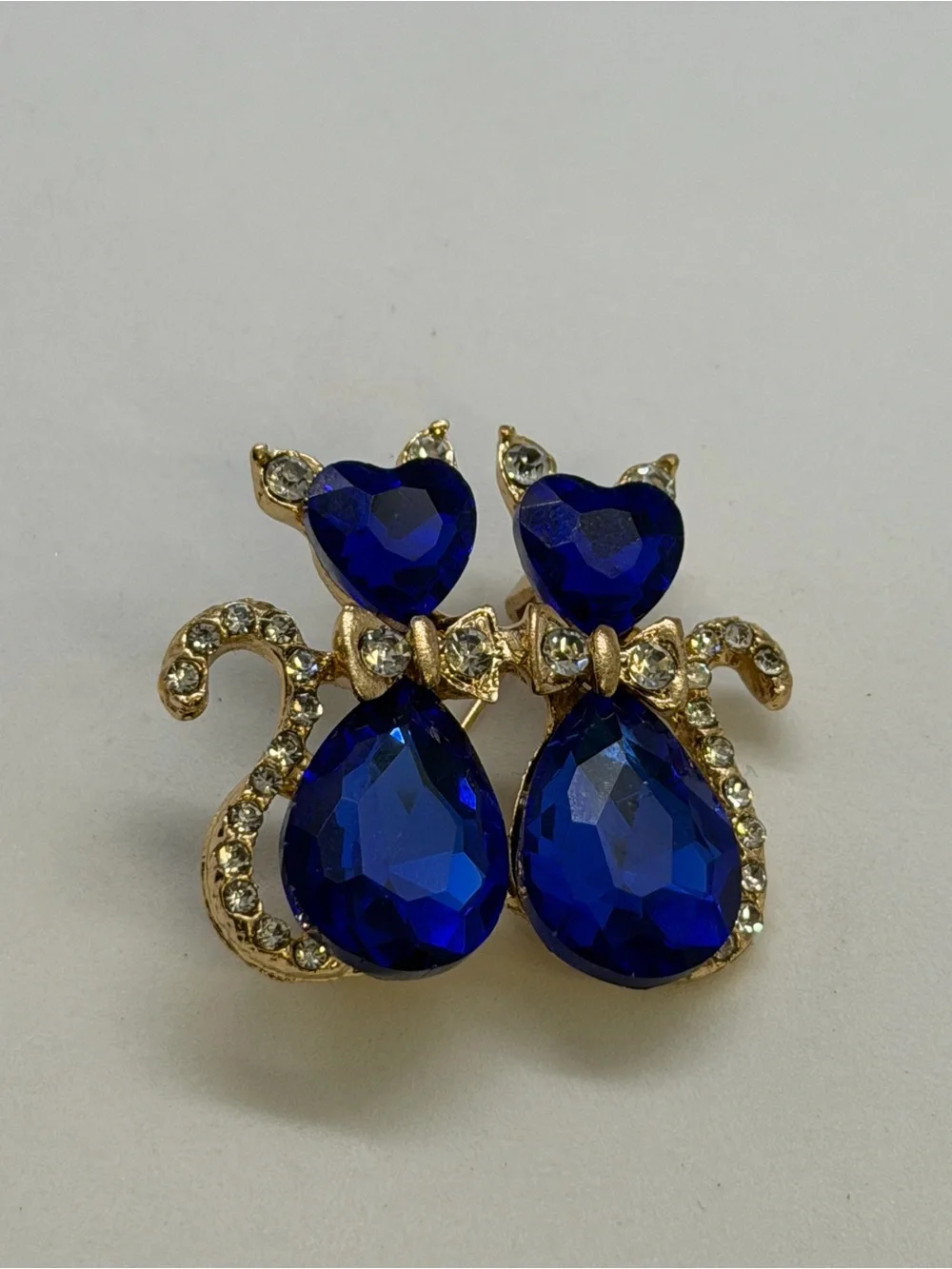 Gold-Tone Cat Duo Brooch with Deep Blue Crystal Accents